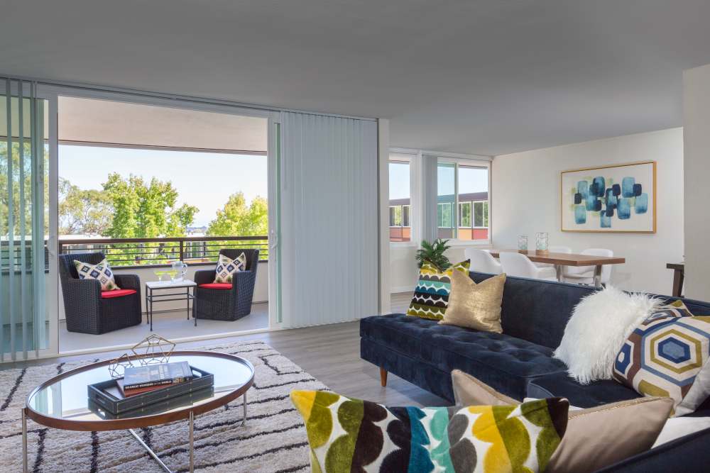 Specious living room with access to private patio at Belmont Glen Residences in Belmont, California