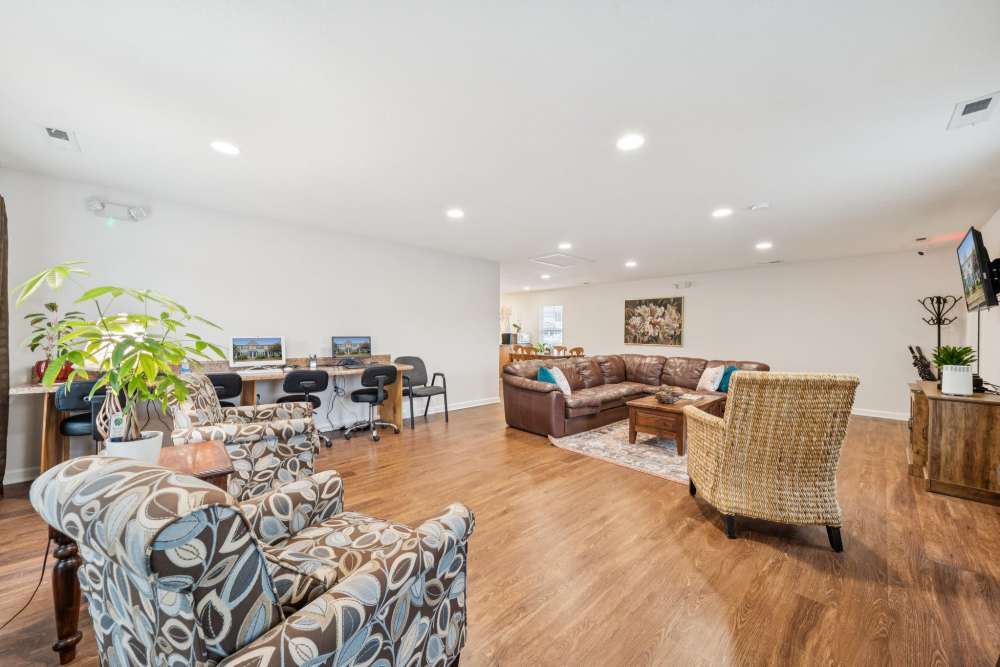 Stylish clubhouse with wooden flooring at Maplewood in Chesapeake, Virginia