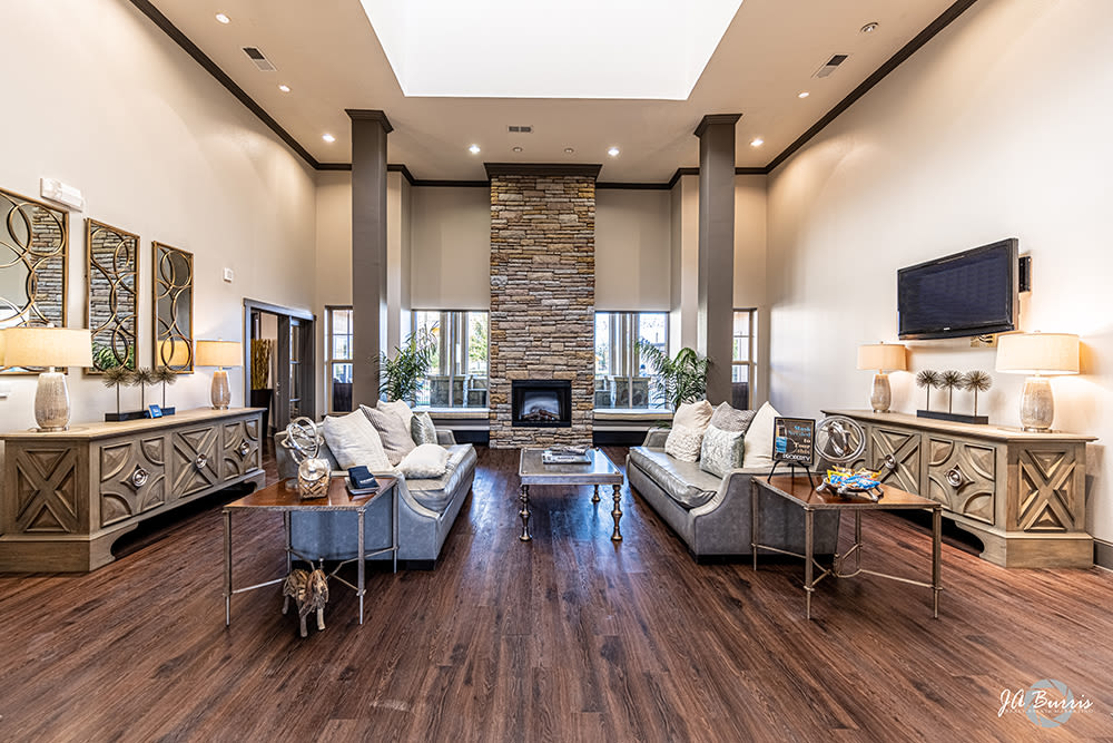 Lounge area with wall mounted tv in clubhouse at Blue Ridge in Midland, Texas