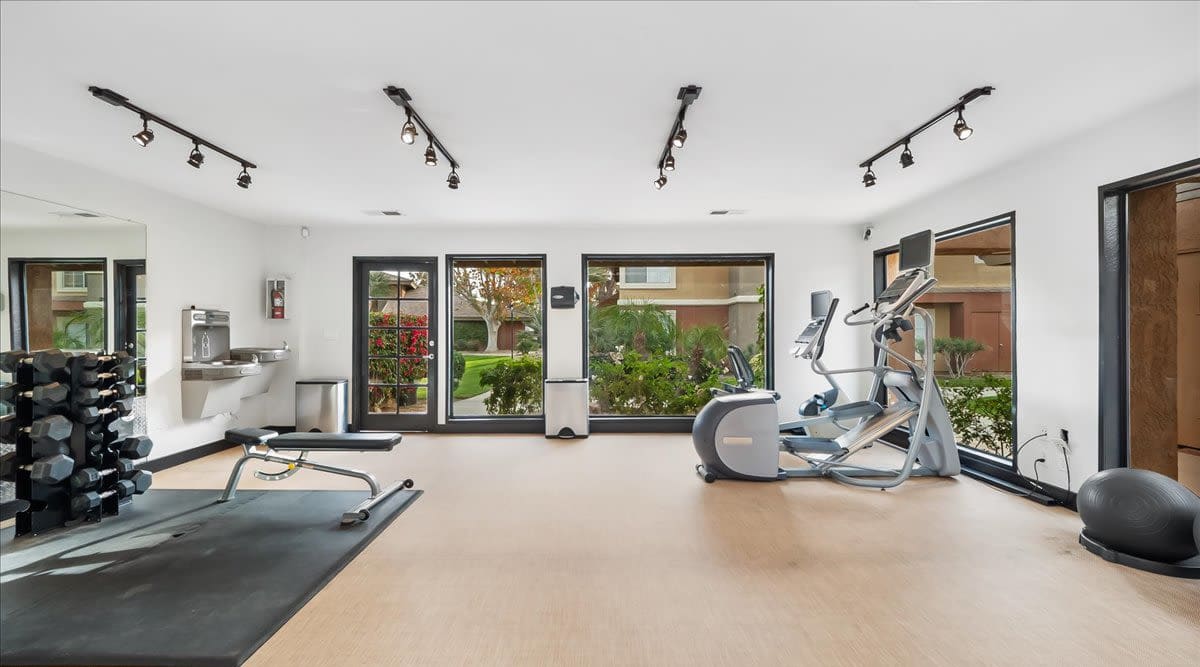 Fitness center with large windows at  Mirabella Apartments in Bermuda Dunes, California