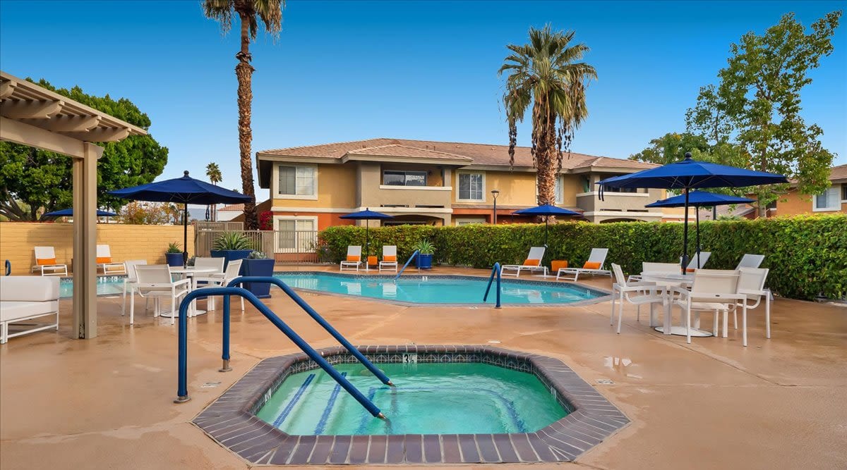 Spa and pool with palm trees at Mirabella Apartments in Bermuda Dunes, California