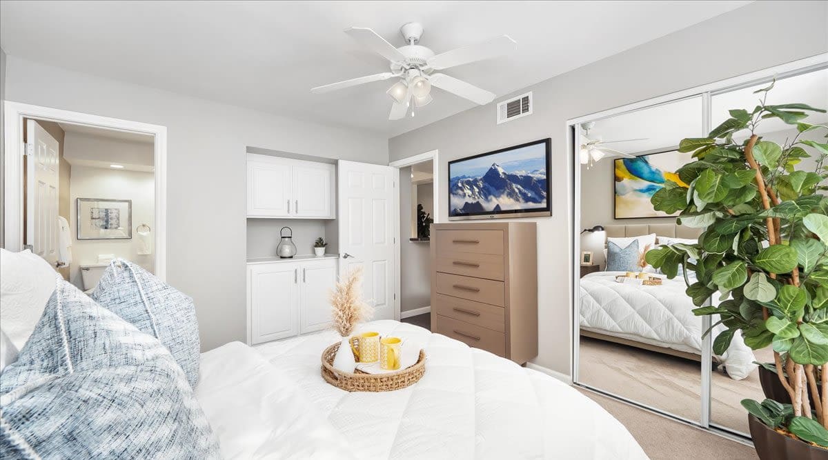 Bedroom with ceiling fan at Mirabella Apartments in Bermuda Dunes, California