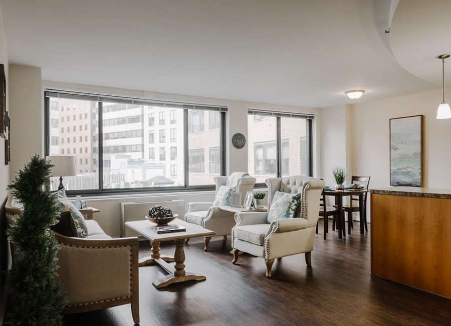 Community seating area with wooden flooring at The Residences at Thomas Circle in Washington, District of Columbia
