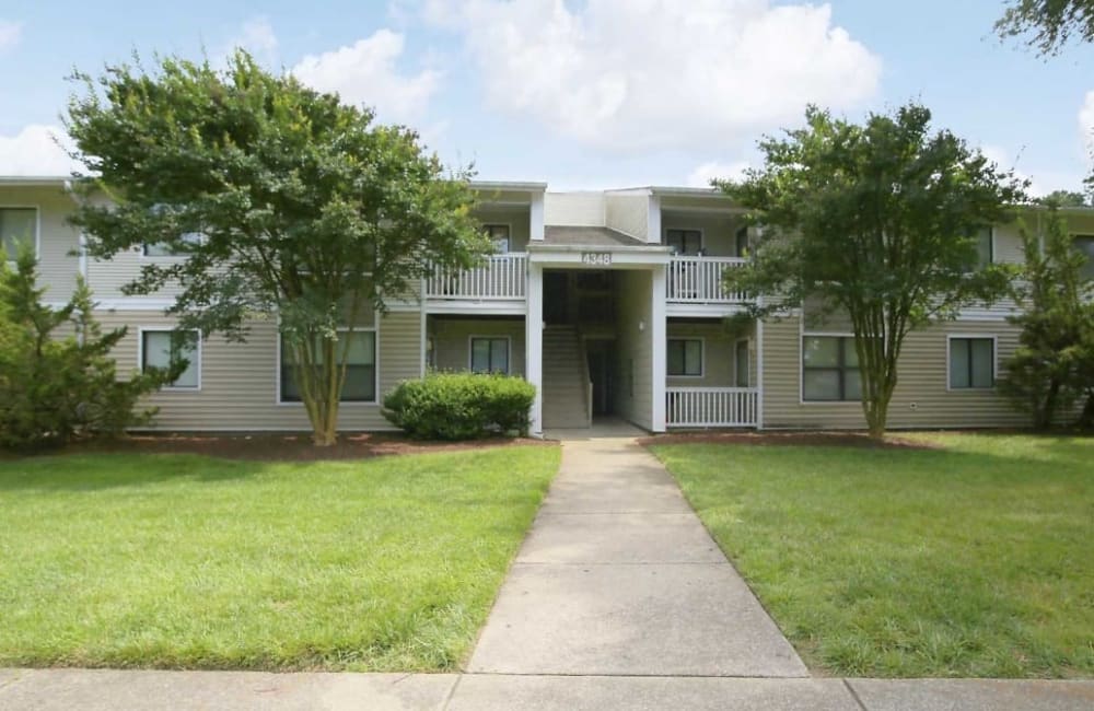 Walkway up to an apartment at Honeytree Apartments in Raleigh, North Carolina