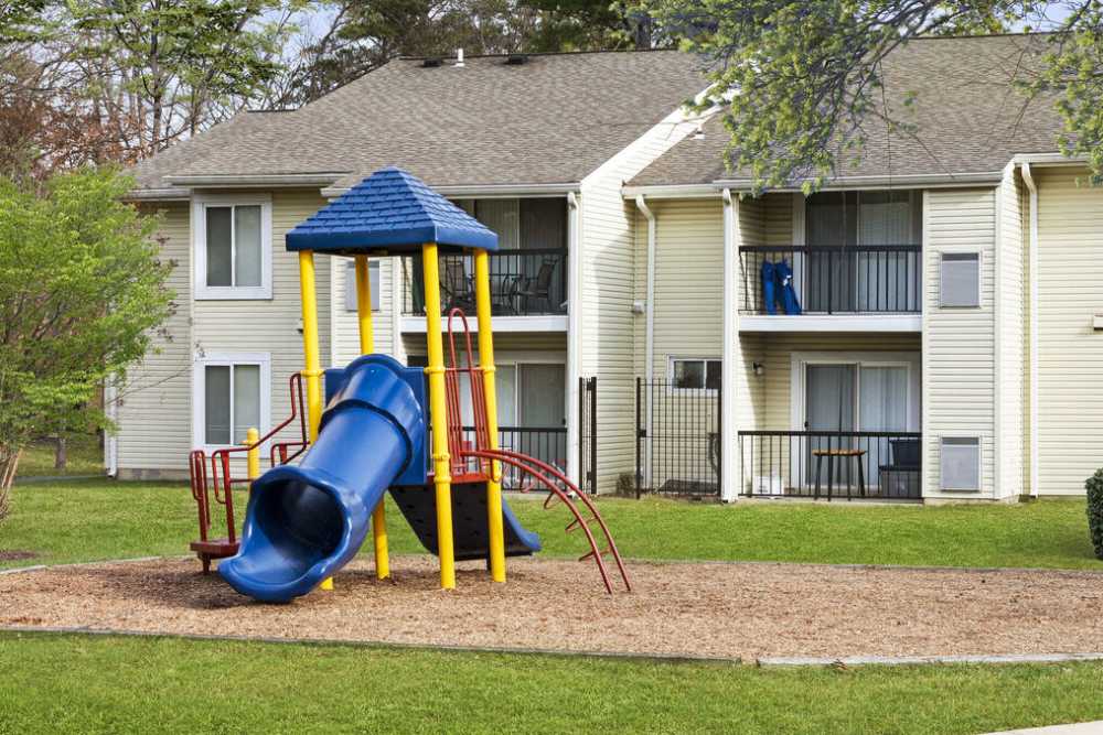 A children's playground with a slide at Smallwood Gardens in Waldorf, Maryland