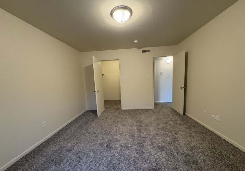 Bedroom with carpet flooring at Mount Vernon Arms Apartments in Merrillville,Indiana