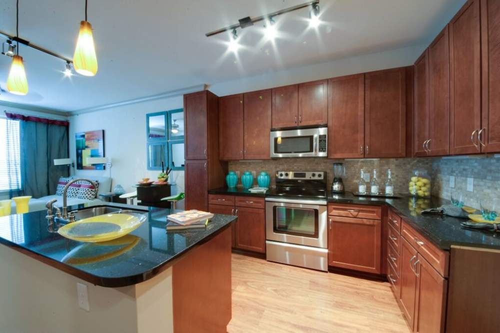Upgraded kitchen with hardwood flooring at Forum on San Felipe in Houston, Texas