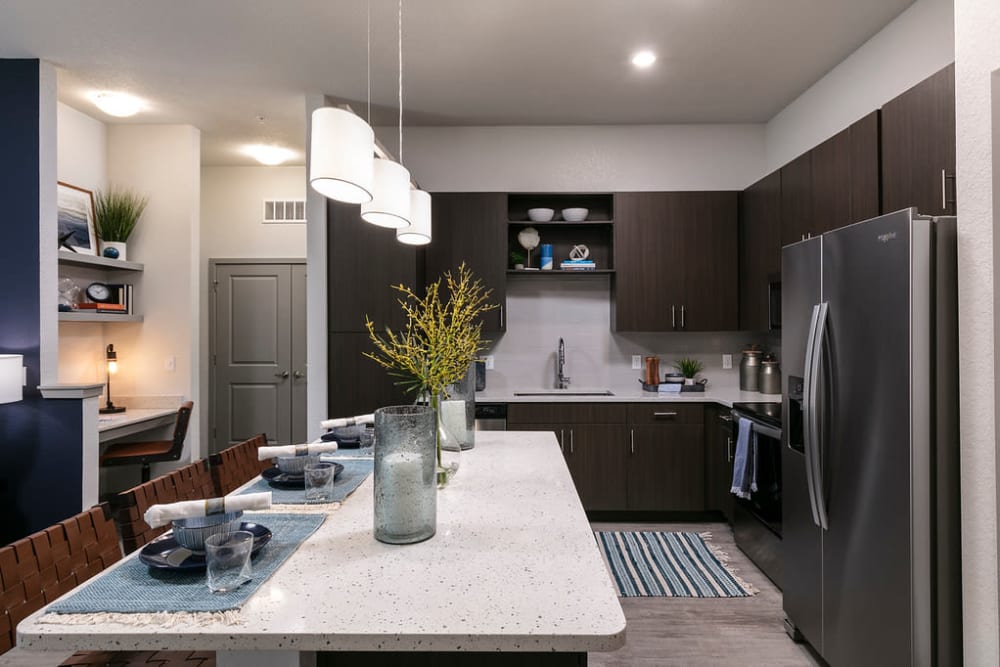 Kitchen with appliances at Integra Crossings in Sanford, Florida