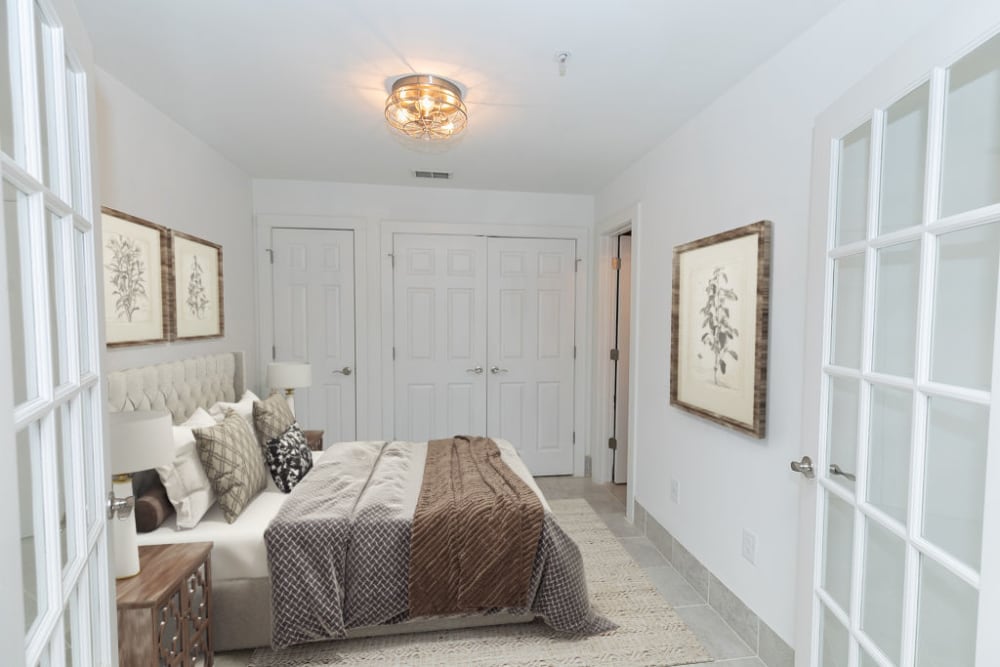 Classically furnished loft home's bedroom at Roosevelt Historic Lofts in Atlanta, Georgia