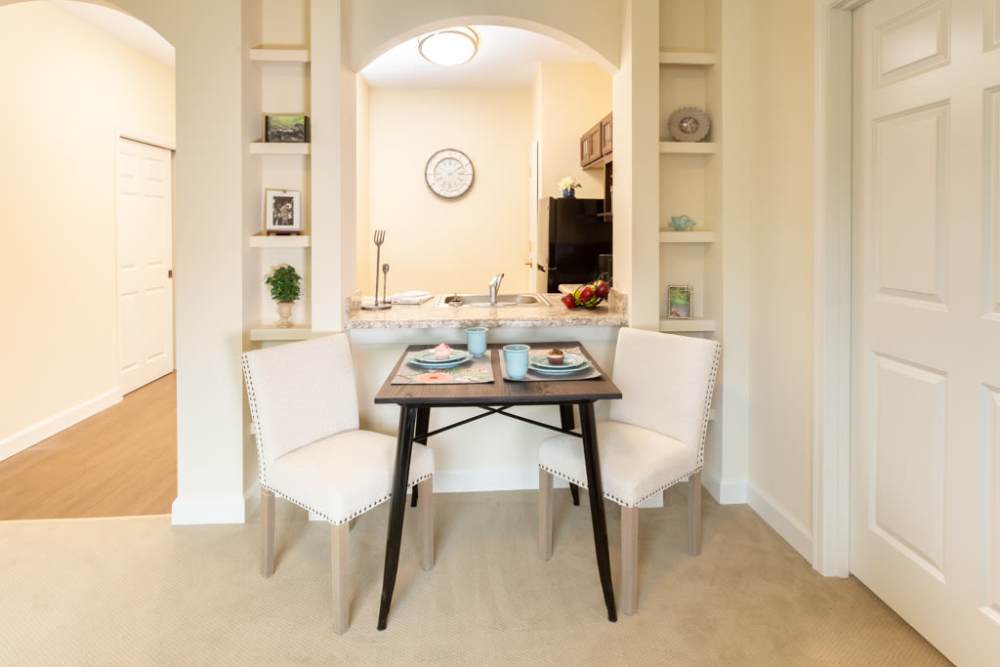 Pretty dining table with a couple of chairs at The Harmony Collection at Roanoke - Assisted Living in Roanoke, Virginia
