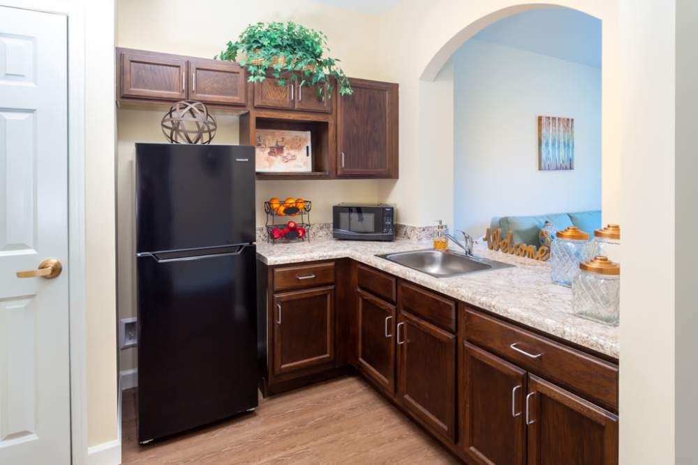 Kitchen with appliances and storage space at The Harmony Collection at Roanoke - Assisted Living in Roanoke, Virginia