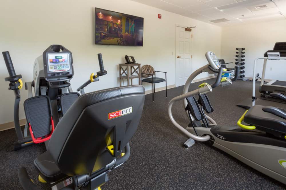 Fitness center with cycles at The Harmony Collection at Roanoke - Assisted Living in Roanoke, Virginia
