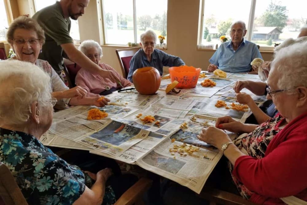 Residents carve pumpkins at Manning Senior Living in Manning, Iowa.