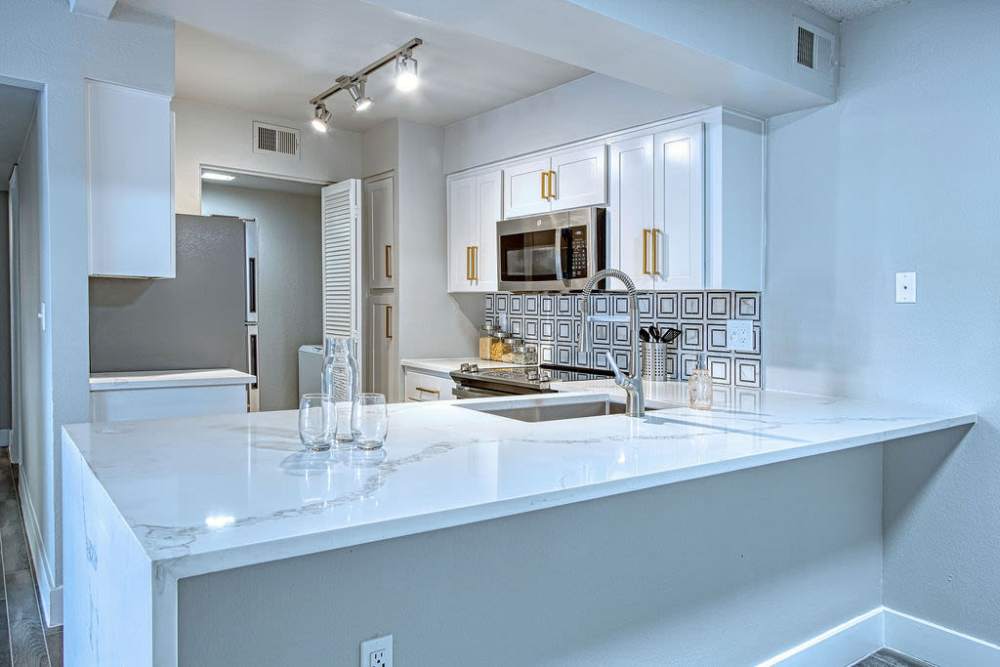 Kitchen with white cabinetry at Strada in Tempe, Arizona