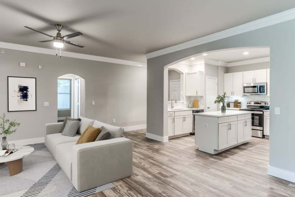 Open-concept of kitchen and living room at Alys in Conroe,Texas