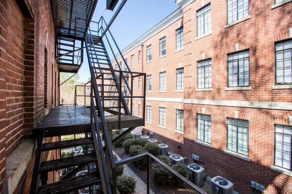 Metal fire escape steps of an apartment at Historic Boylan Apartments in Raleigh, North Carolina