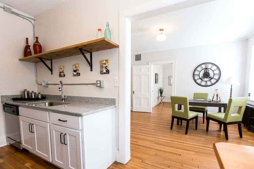 Kitchen with connecting dining space at Historic Boylan Apartments in Raleigh, North Carolina