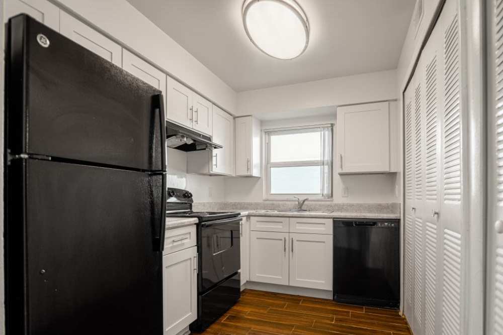Kitchen with white cabinetry at Dunwoodie Place in Orlando, Florida