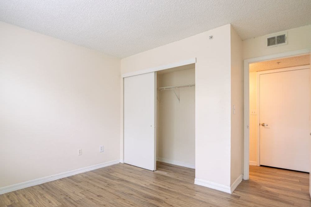 Open closet with access to bedroom at Logan Heights in Sanford, Florida