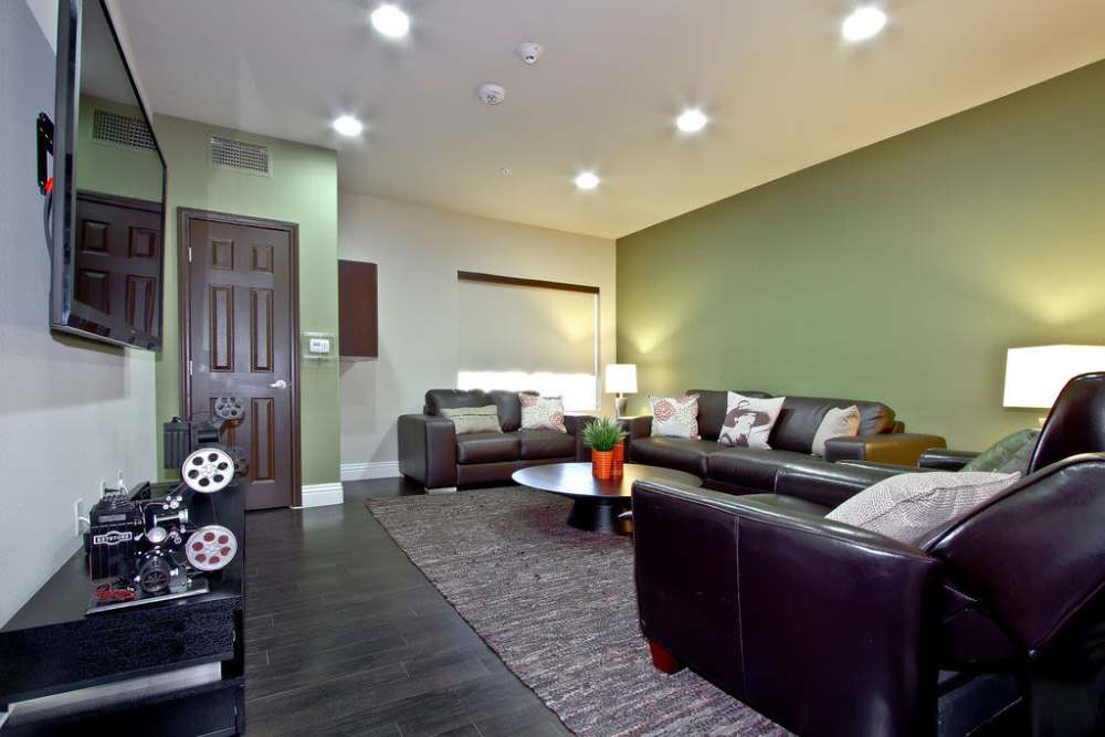 Spacious living room with tv and carpet at Acapella in Las Vegas, Nevada