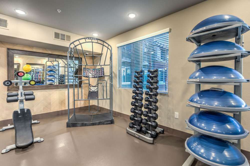 Fitness center with dumbbells at Harmony in Las Vegas, Nevada 