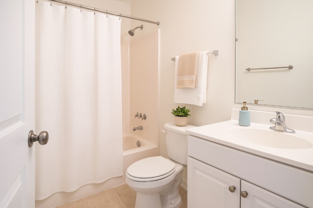Bathroom with vanity unit at Creekwood Apartments in Gainesville,Florida