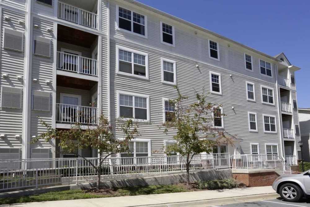 Community apartment exterior with balcony at Corrigan Square Apartments in Gaithersburg, Maryland
