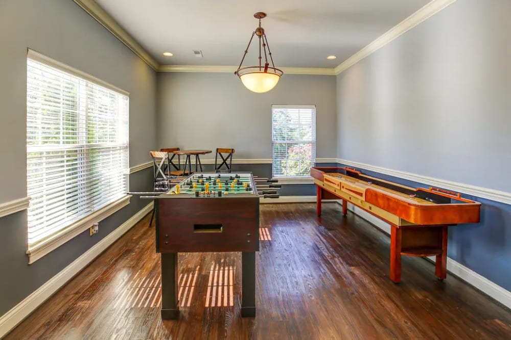 Foosball, shuffleboard and a tall table in the clubhouse at Charleston Pines Apartment Homes in Florence, Kentucky 