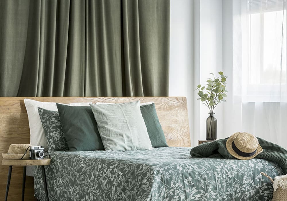 Modern-style, well-lit bedroom with queen-size bed, wooden headboard, small and sheek bedside table at Everwood at The Avenue in Murfreesboro, Tennessee