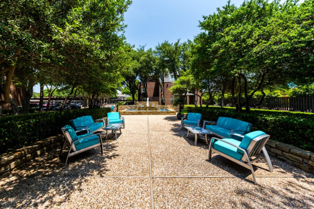 Outdoor water feature with sitting area at Marquis at Legacy in Plano, Texas