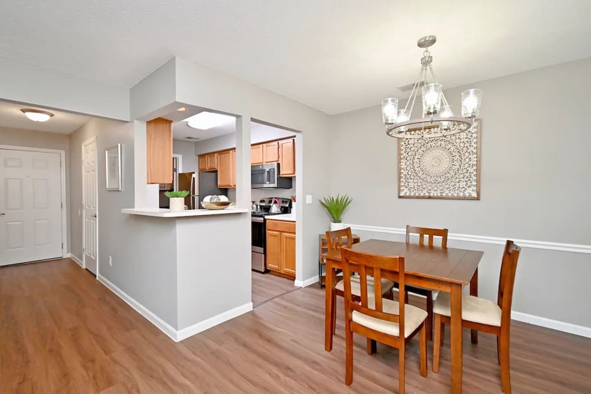 Cozy dining space adjacent to the kitchen at Woodspring Apartments in Florence, Kentucky