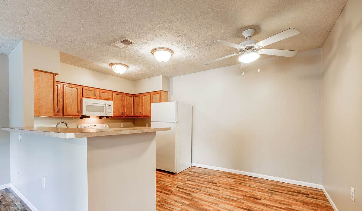 White refrigerator and wooden cabinets at Autumn Run in Millersburg, Ohio