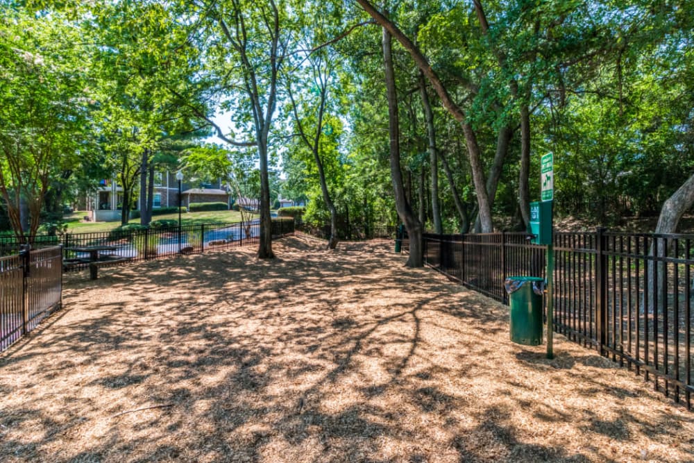 Spacious dog park with pet waste station at Marquis at Carmel Commons in Charlotte, North Carolina