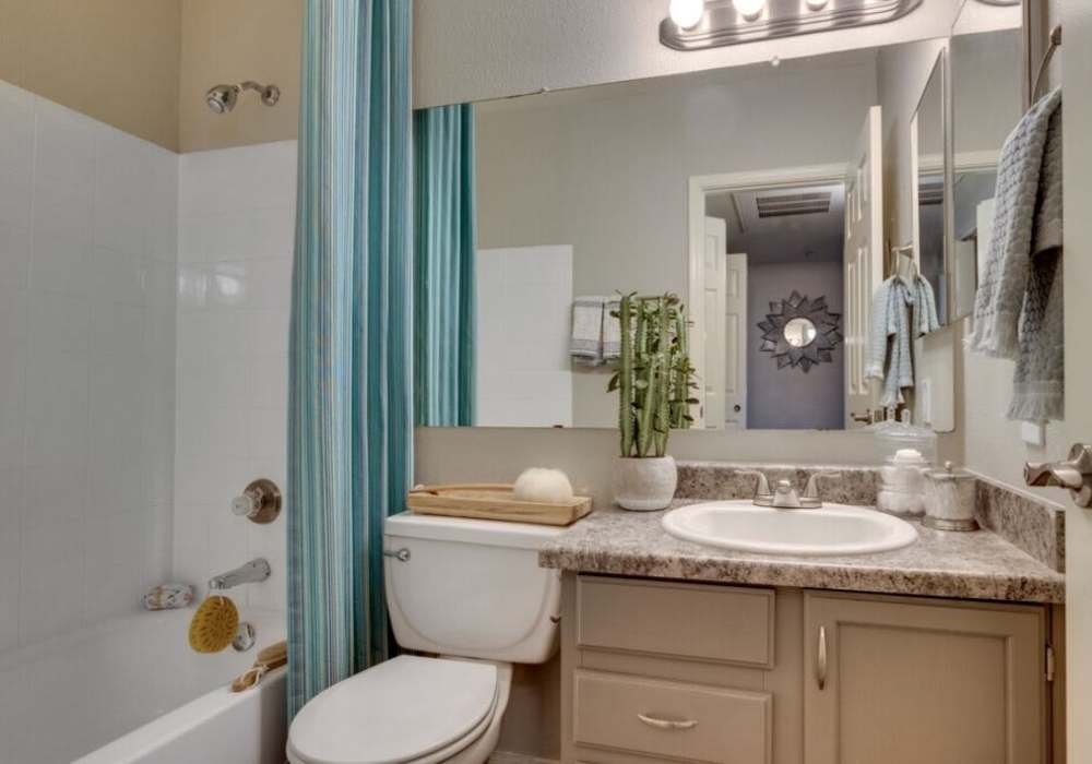Bright bathroom with large mirror and endant lights at Alcove at the Islands in Gilbert, Arizona, 