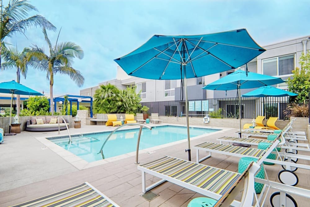 Resort stlye pool with poolside seating at Angelene Apartments in West Hollywood, California