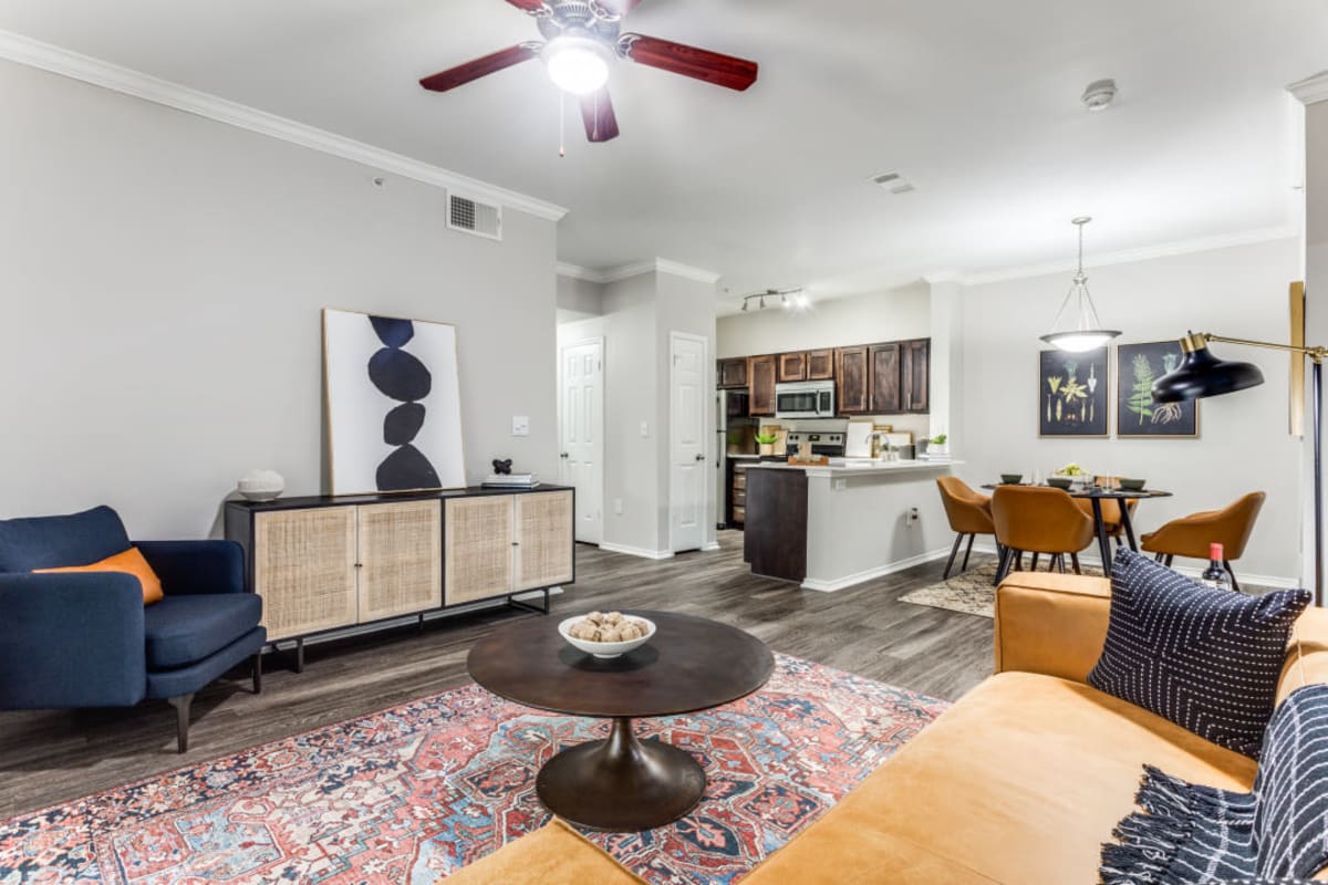 Furnished living room with wood-style flooring at Sycamore Springs in Austin, Texas