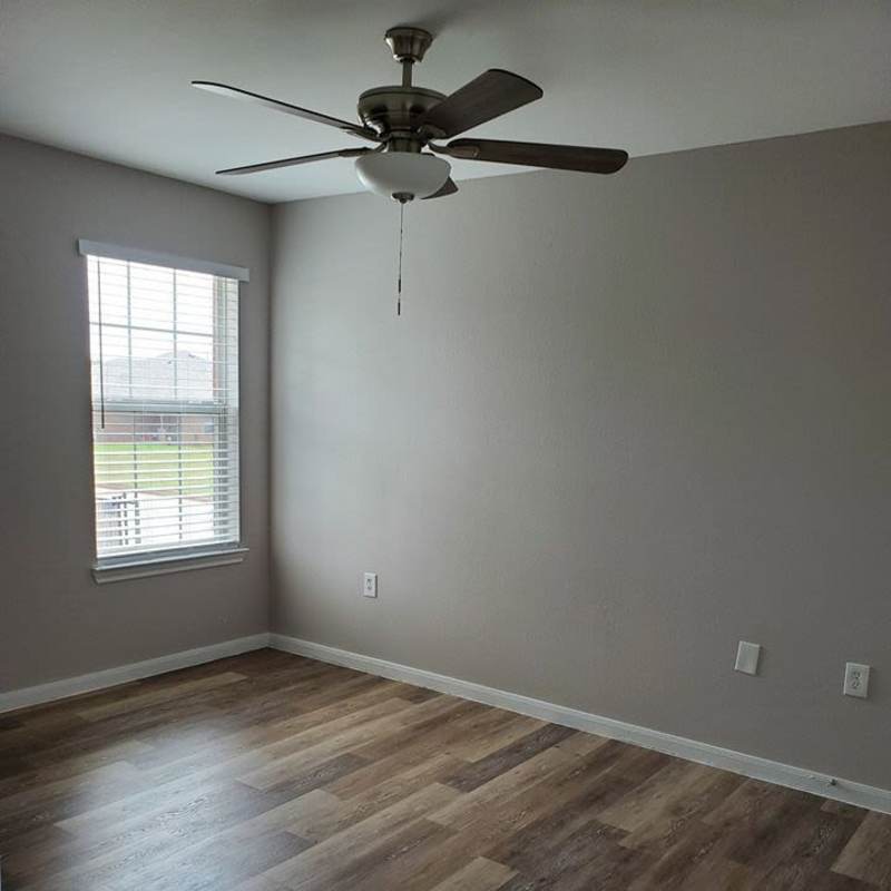 Bright bedroom with window at Autumn Brook Apartments in Chickasha, Oklahoma