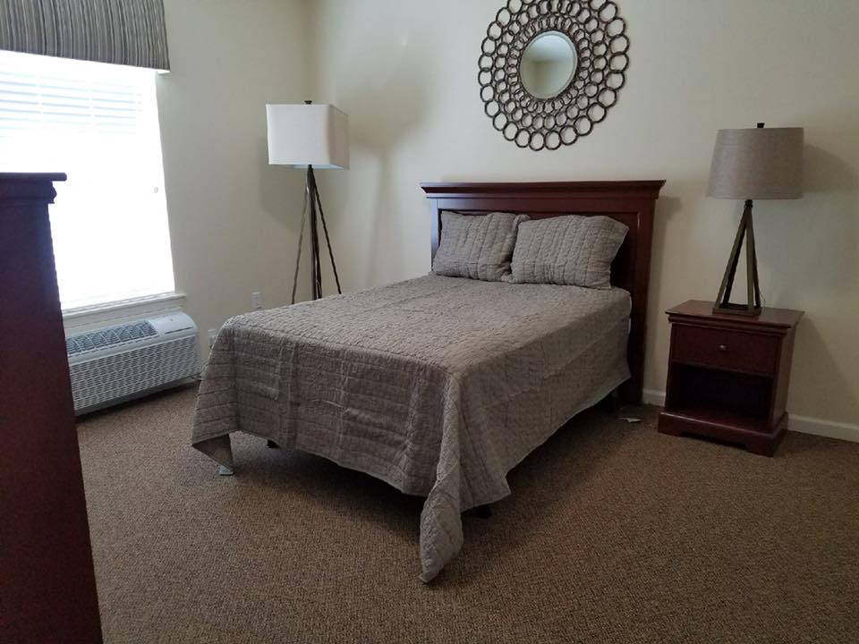 One bedroom with full size bed at Parkside Senior Living in Rolla, Missouri