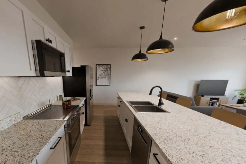 Luxury kitchen with island and pendant lights at Russ Town Crossing in Ruston, Louisiana