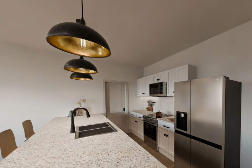 Furnished open layout kitchen with pendant lights at Russ Town Crossing in Ruston, Louisiana