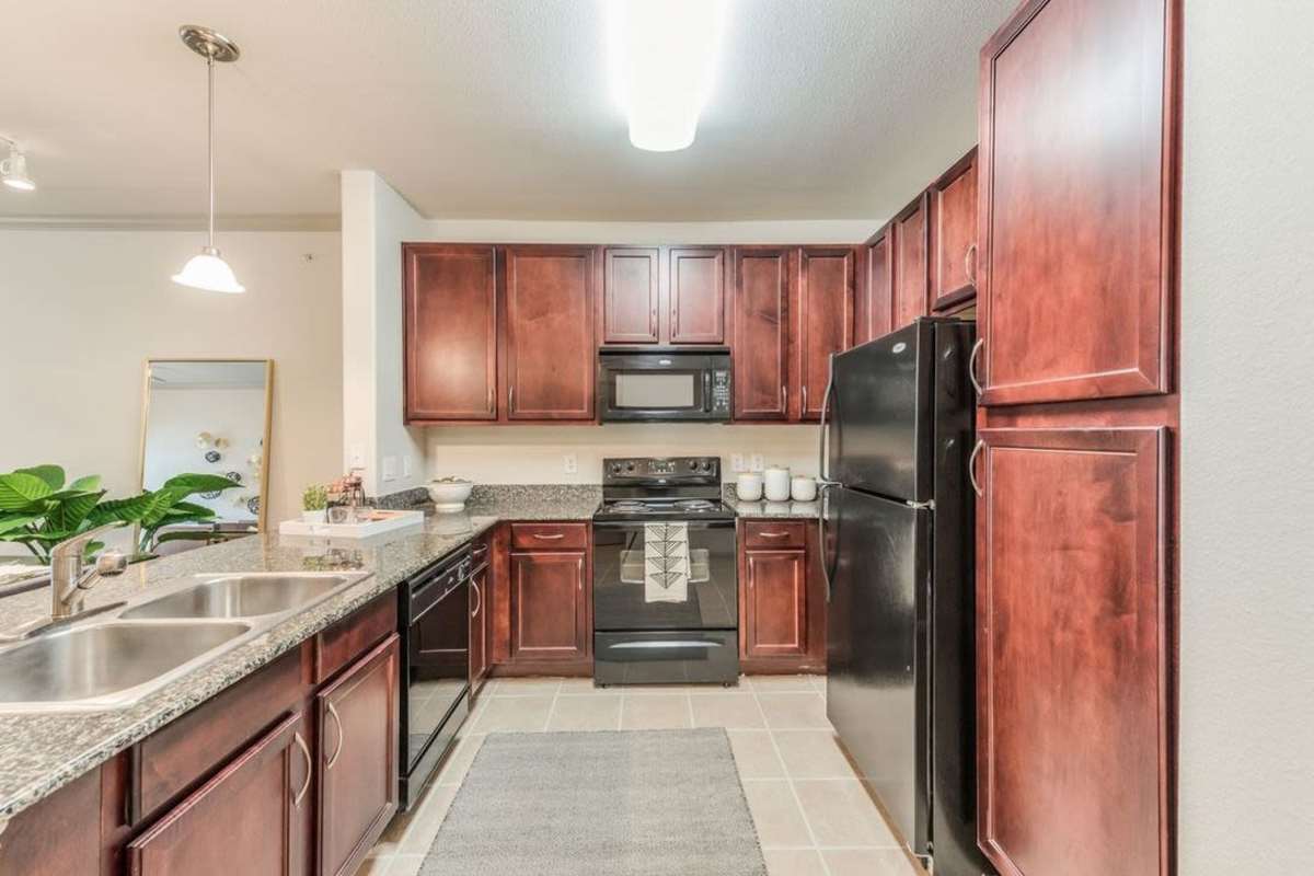 Kitchen with steel sink at Villas At Bunker Hill, Houston, Texas