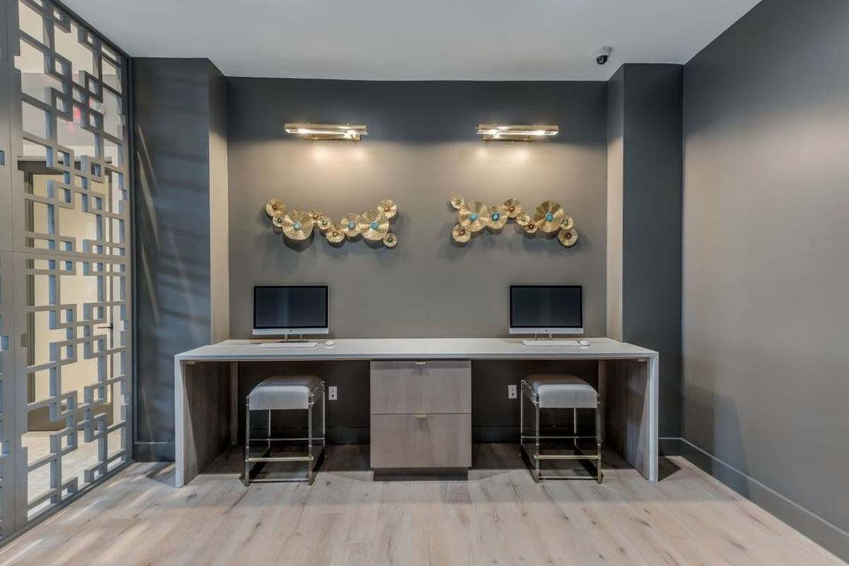 Sleek workplace with decorative walls at Villas At Bunker Hill, Houston, Texas
