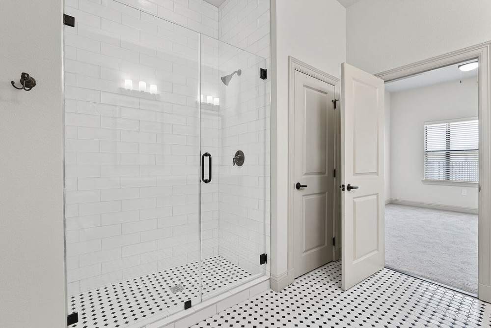 Bathroom with tile flooring and walk-in shower at Domain Memorial in Houston, Texas