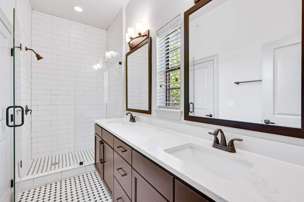 Bathroom with window and vanity at Domain Memorial in Houston, Texas