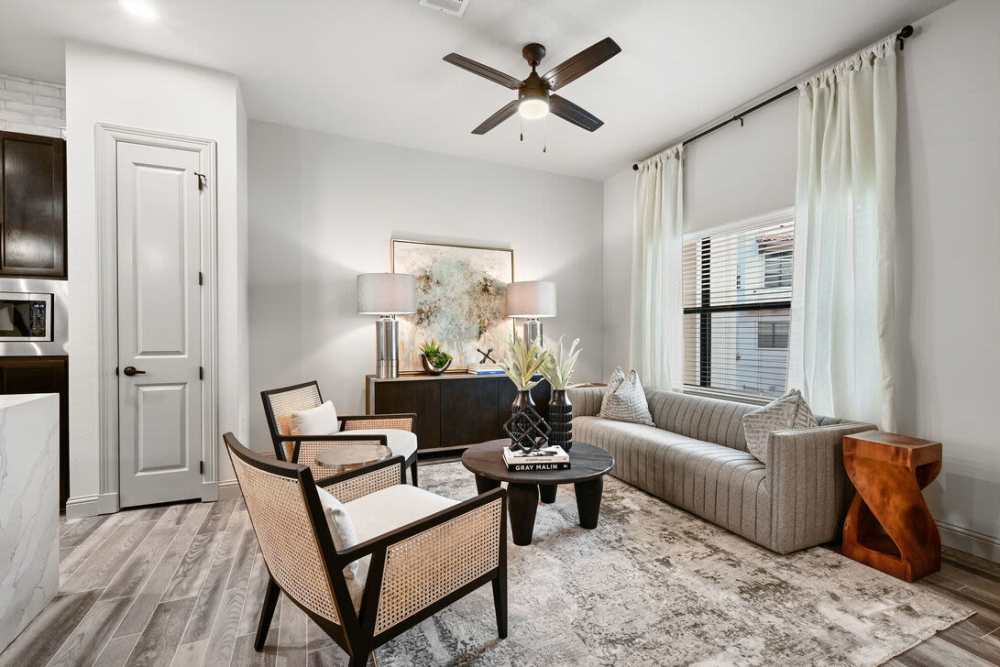 Living room with large sofa and center table at Domain Memorial in Houston, Texas