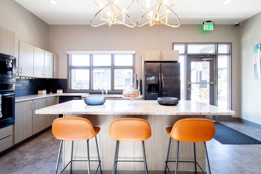 Open kitchen with a dining area at Ravello 192 in Elkhorn, Nebraska