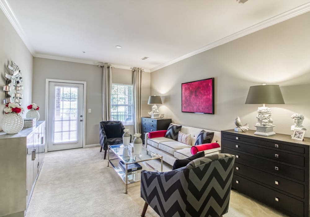 Bright and spacious living room with an intuitive layout, including access to patio or balcony at Glass Creek in Mt Juliet, Tennessee