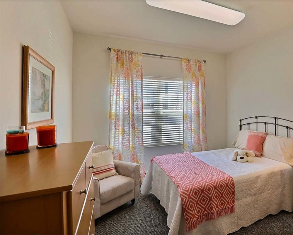 Cozy resident bedroom at Milestone Senior Living Stoughton in Stoughton, Wisconsin.