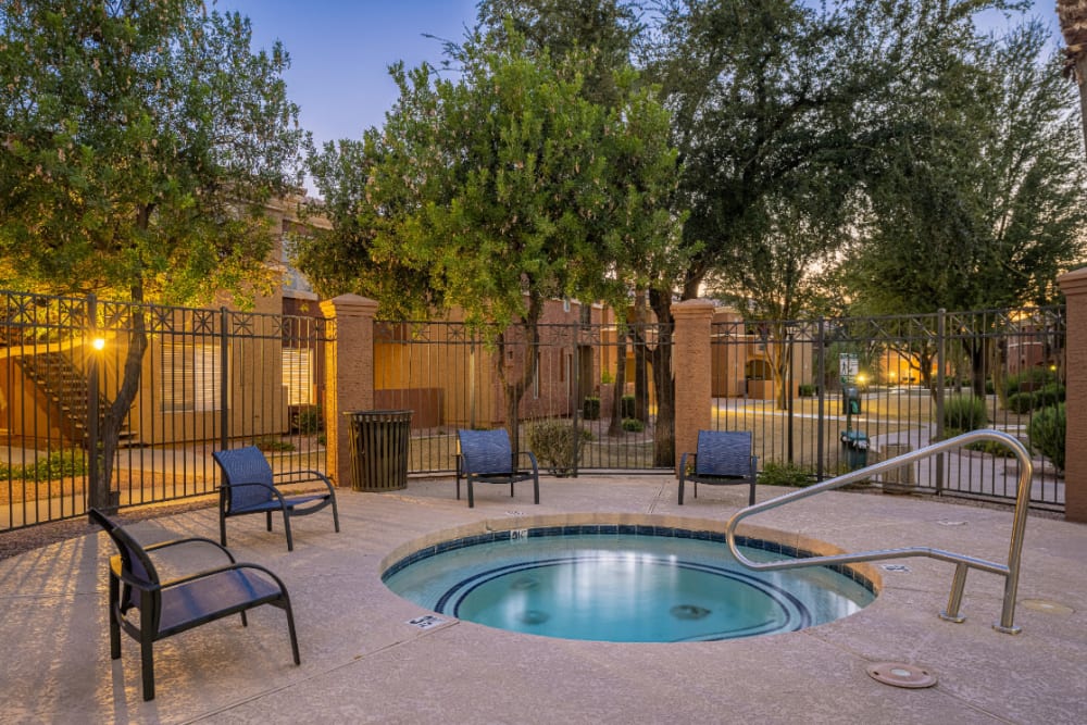 Gated hot tub with lounge chairs at Alante at the Islands in Chandler, Arizona