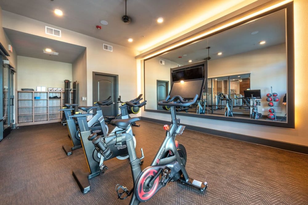 Stationary bikes in the fitness center at Switchyard in Carrollton, Texas